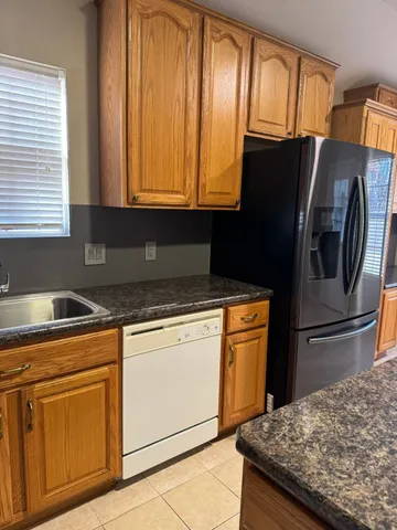 a view of a hallway to rooms and stairs
