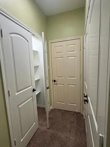 a bathroom with a granite countertop sink toilet a mirror and shower