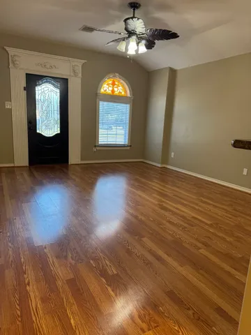 a view of a kitchen with furniture and a window