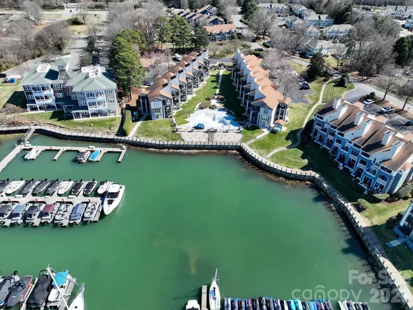 an aerial view of a house with a garden lake view