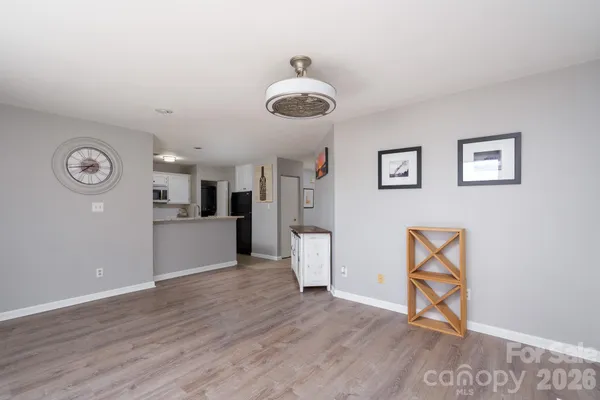 a kitchen with stainless steel appliances granite countertop a sink and a stove