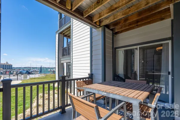 an aerial view of a house a yard swimming pool and outdoor seating