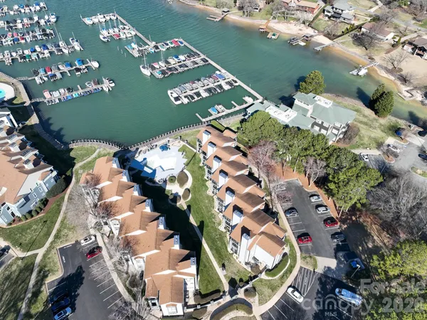 an aerial view of a house with a lake view