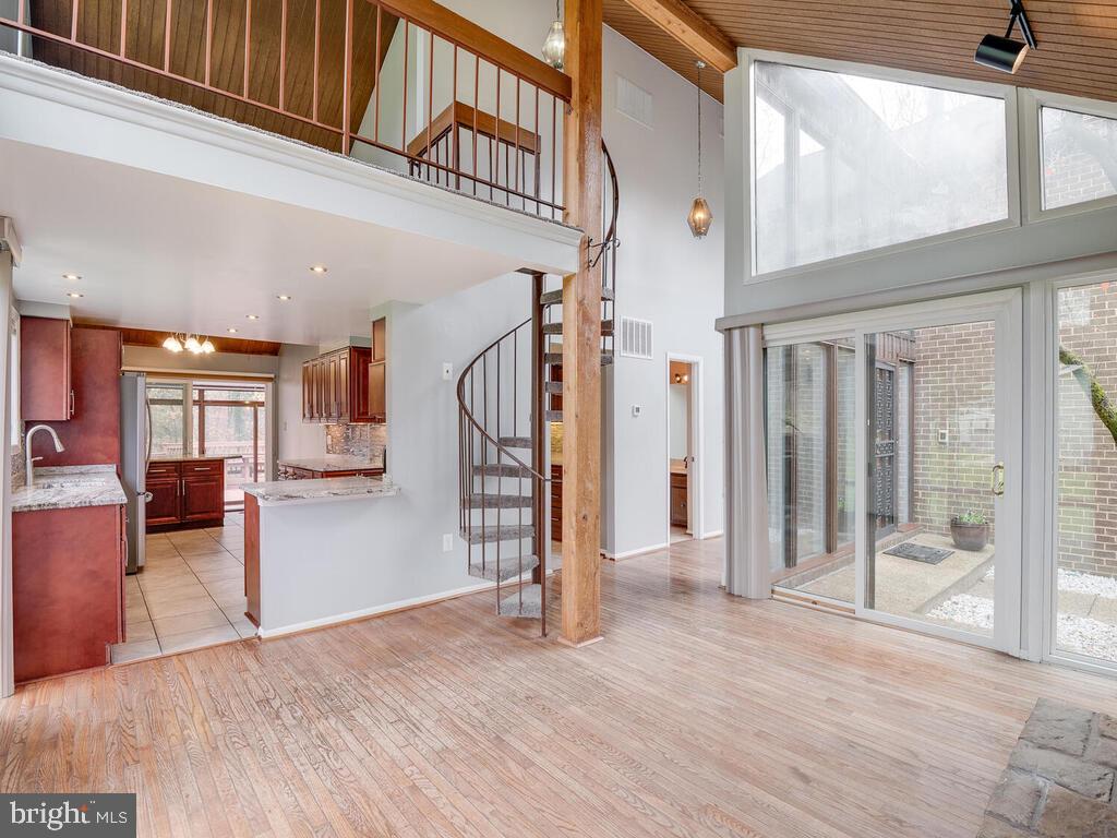 5316 Tolson Road Temple Hills, MD 20748 - Photo 17 of 69 Spiral staircase with view of loft and kitchen
