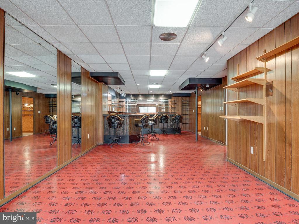 5316 Tolson Road Temple Hills, MD 20748 - Photo 56 of 69 Lower level #1- Rec Room with shelving