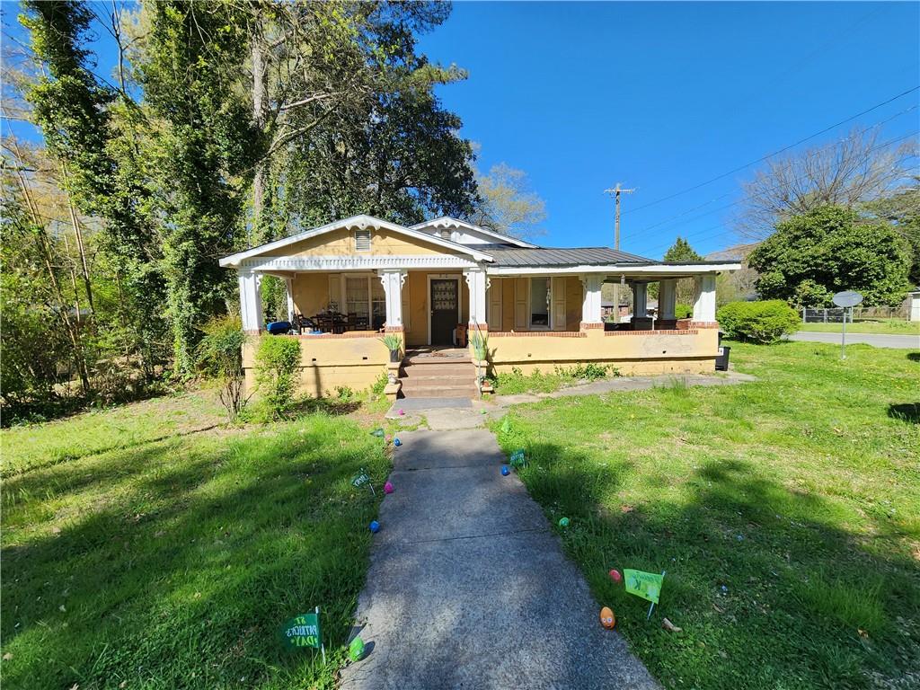 500 Wilson Avenue Southwest Rome, GA 30161 - Photo 1 of 1 a front view of a house with a yard