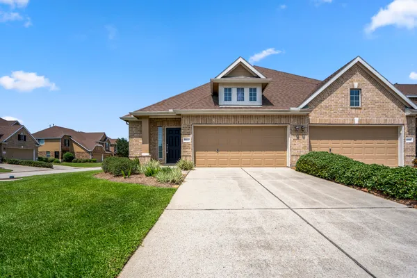 a front view of a house with yard