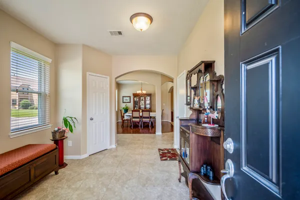a livingroom with workspace and a window