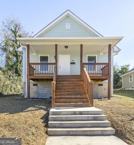 a front view of a house with a porch