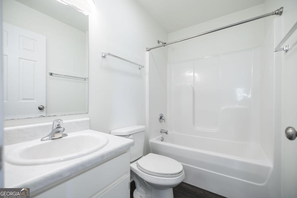 338 Monroe Street Macon, GA 31201 - Photo 20 of 25 a bathroom with a sink toilet and shower
