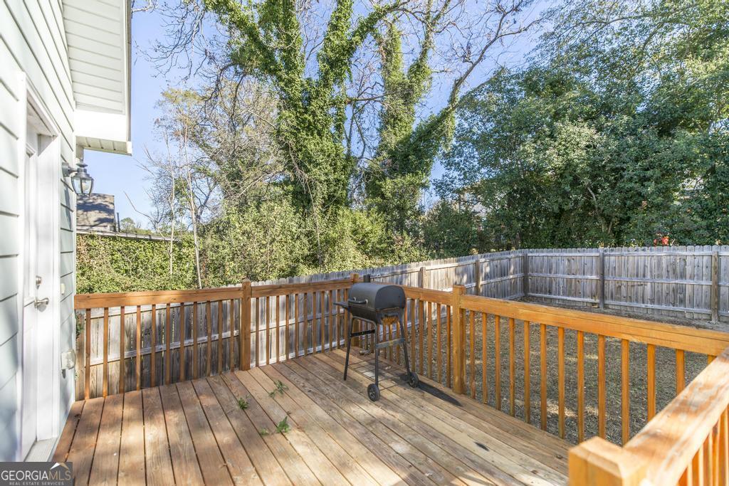 338 Monroe Street Macon, GA 31201 - Photo 21 of 25 a view of a balcony with wooden floor and fence