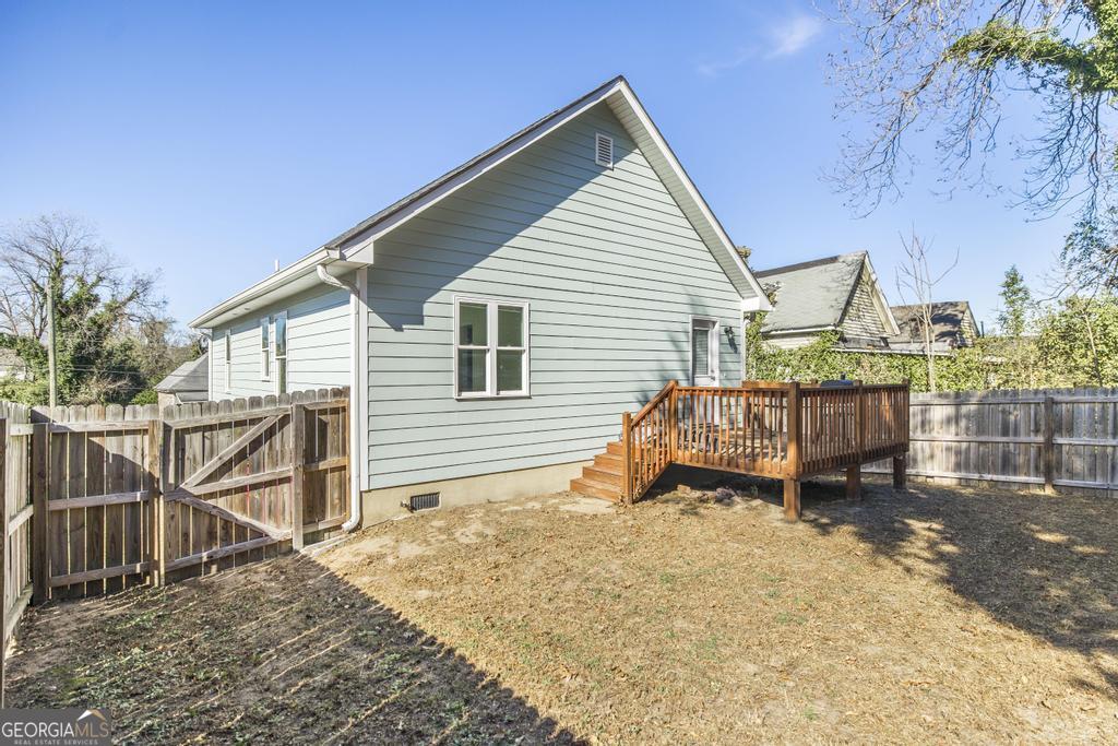 338 Monroe Street Macon, GA 31201 - Photo 22 of 25 a view of a house with wooden deck area and wooden fence