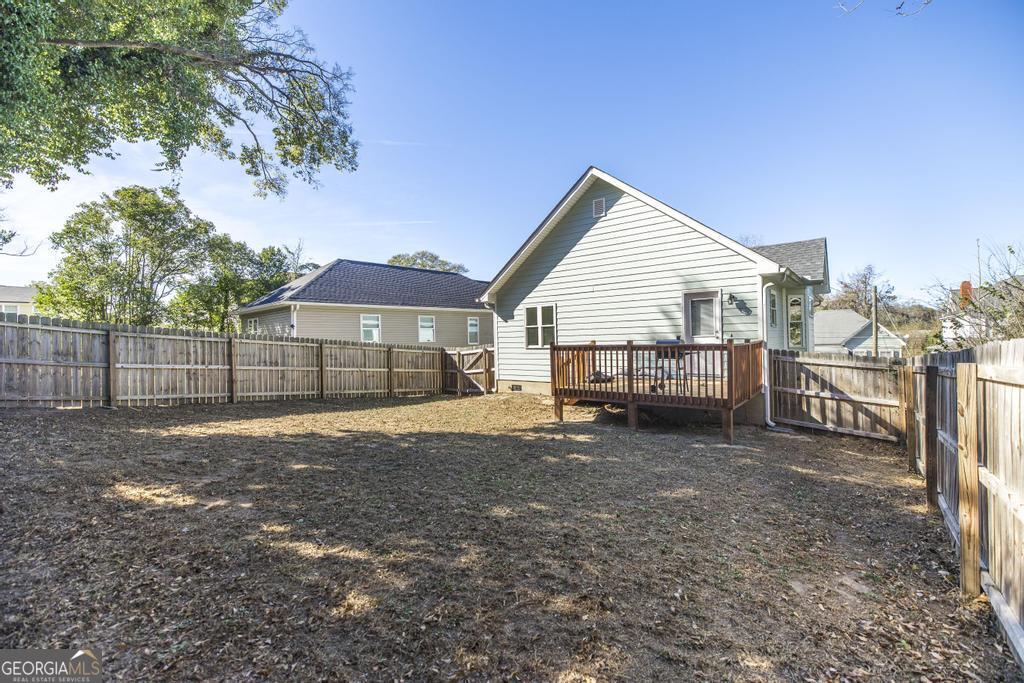 338 Monroe Street Macon, GA 31201 - Photo 24 of 25 a view of a house with backyard and trees