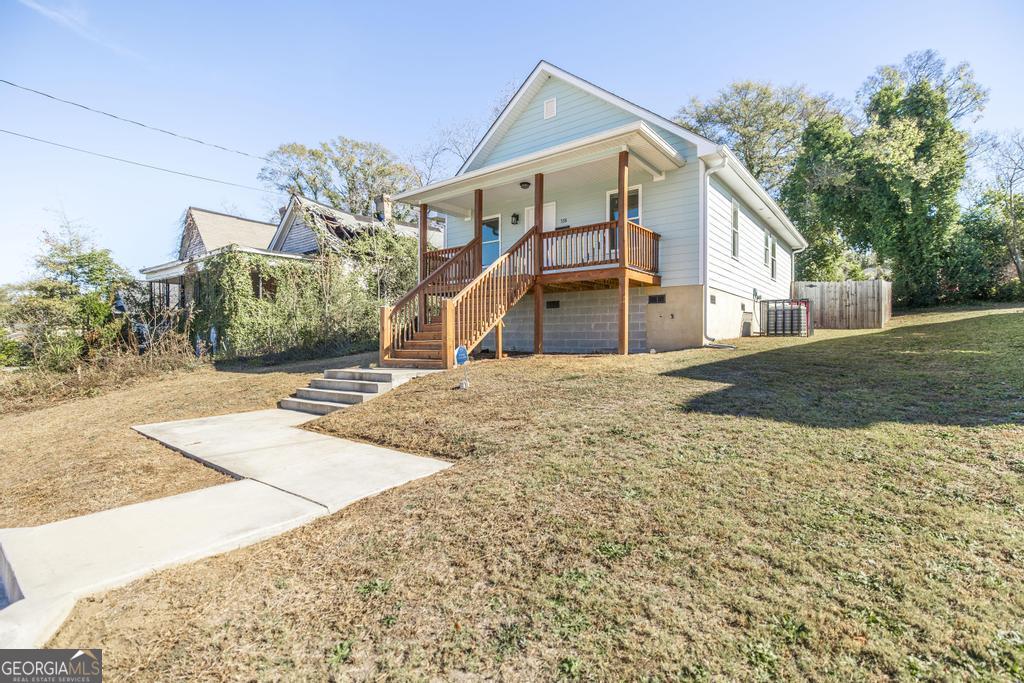 338 Monroe Street Macon, GA 31201 - Photo 4 of 25 a view of a house with a yard