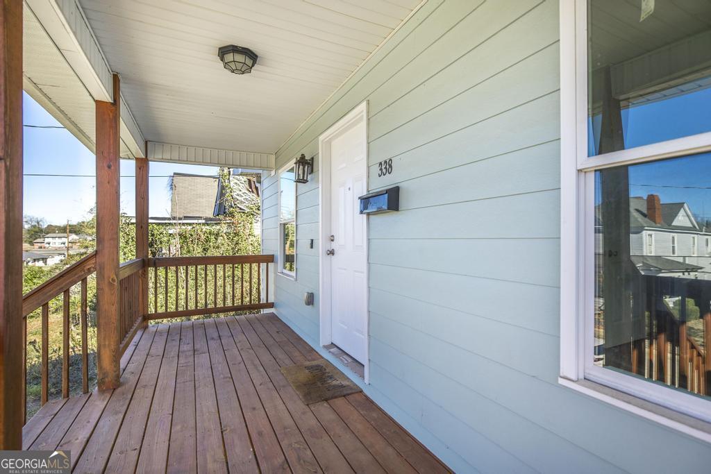 338 Monroe Street Macon, GA 31201 - Photo 6 of 25 a view of a porch with wooden floor and outdoor space
