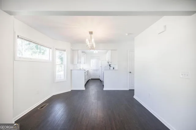 a view of a livingroom with wooden floor