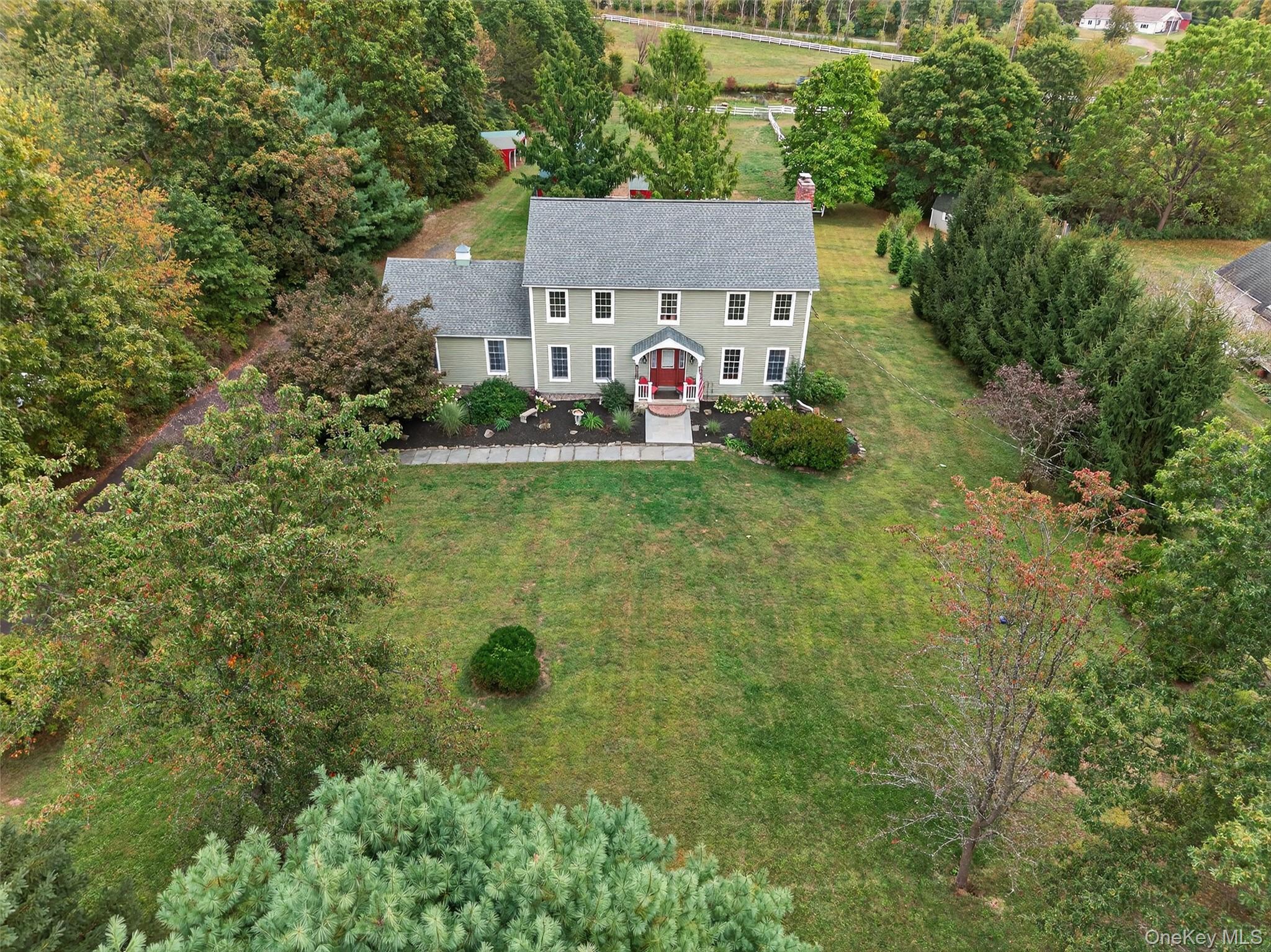 214 Dubois Road Gardiner, NY 12561 - Photo 2 of 38 a aerial view of a house with yard and trees all around