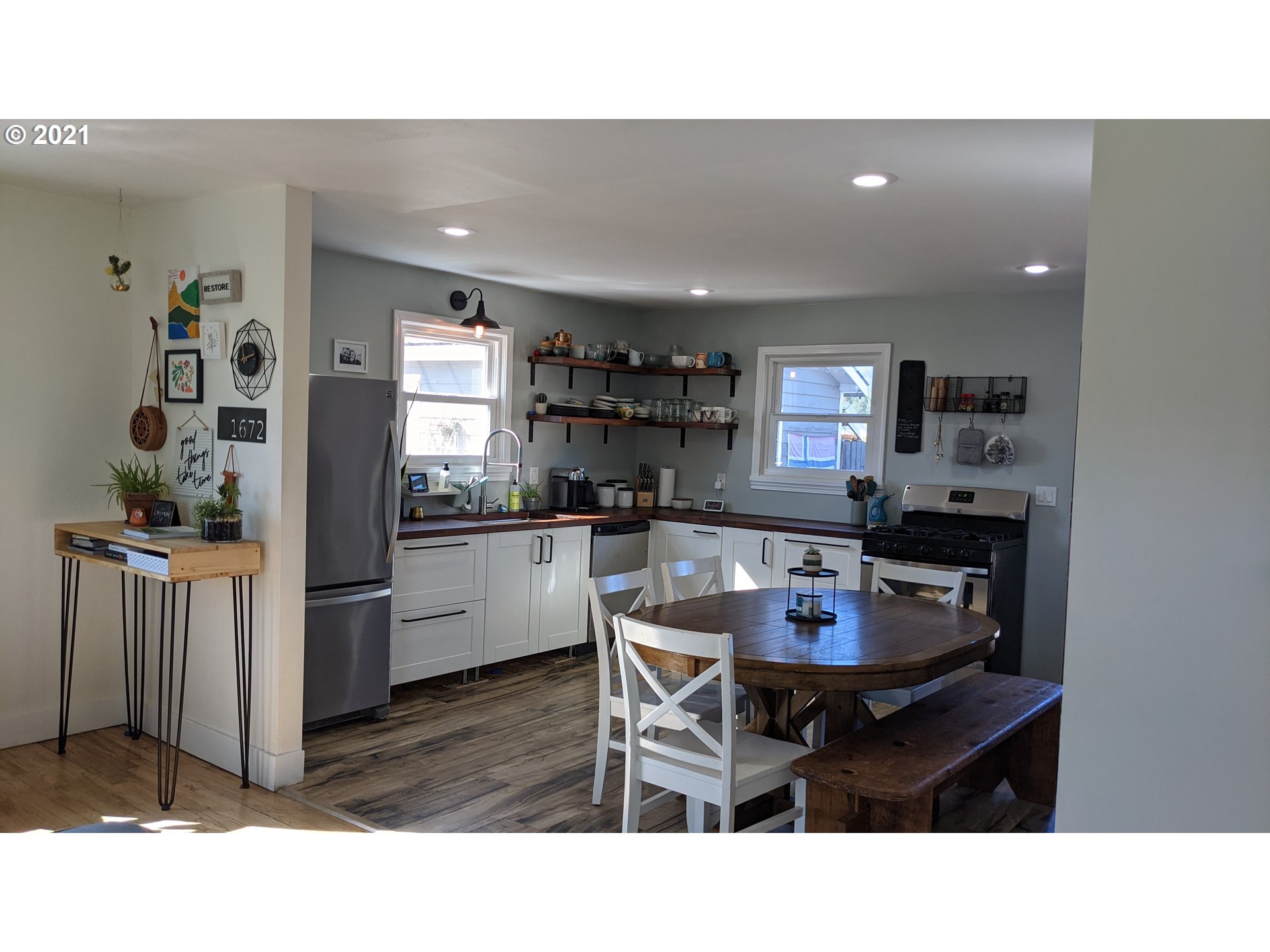 1672 Tucker Road Hood River, OR 97031 - Photo 3 of 15 a kitchen and a dining table in a kitchen
