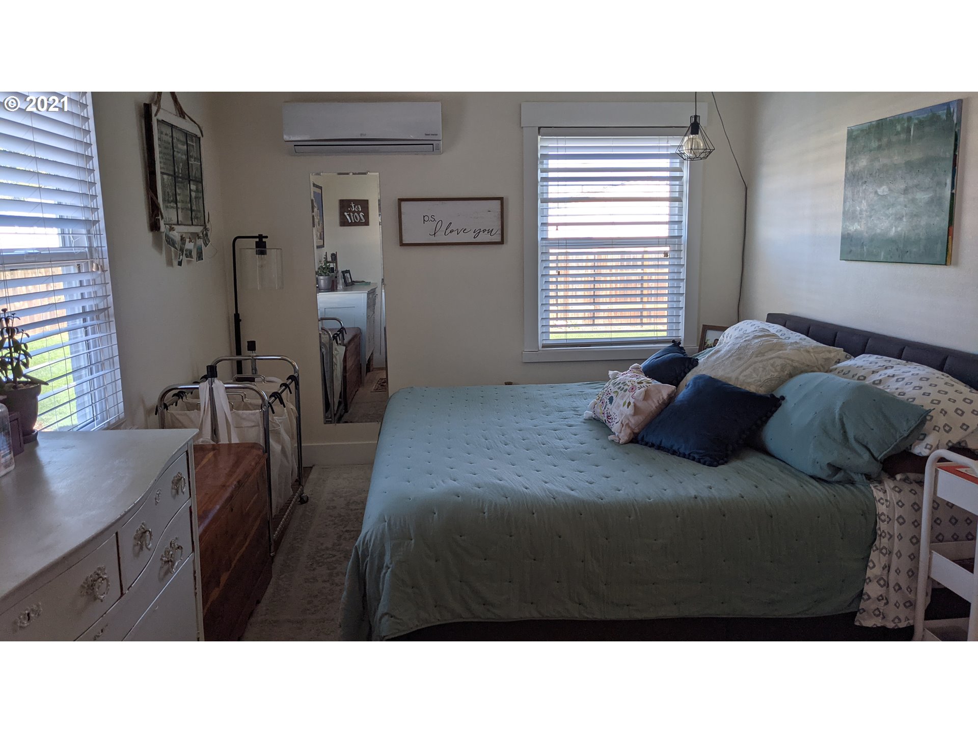 1672 Tucker Road Hood River, OR 97031 - Photo 5 of 15 a bedroom with a bed window and table