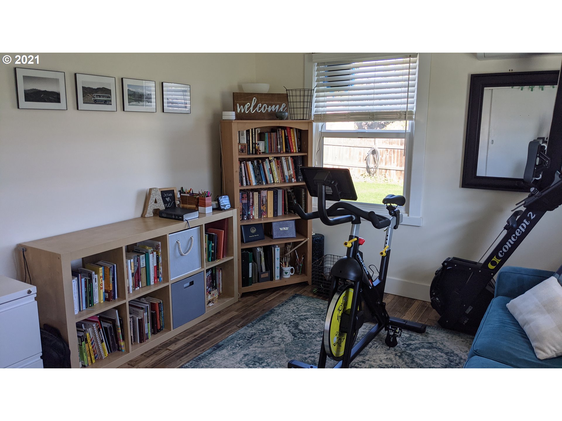 1672 Tucker Road Hood River, OR 97031 - Photo 10 of 15 a living room with lots of furniture and a book shelf