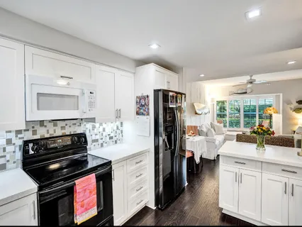 a kitchen with a refrigerator stove and sink