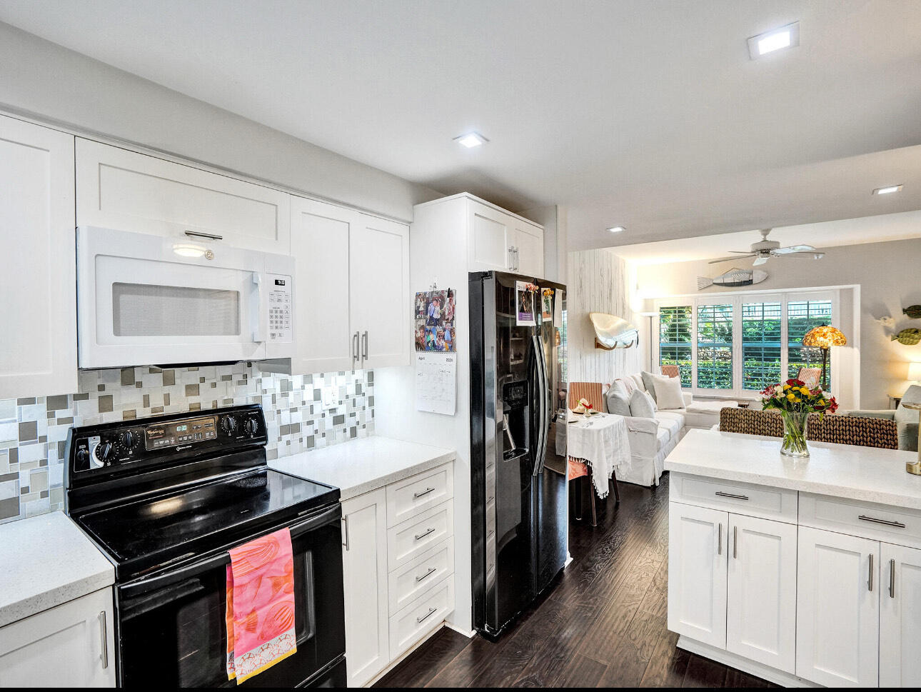 6590 North Ocean Boulevard, Unit 9 Ocean Ridge, FL 33435 - Photo 12 of 18 a kitchen with a refrigerator stove and sink