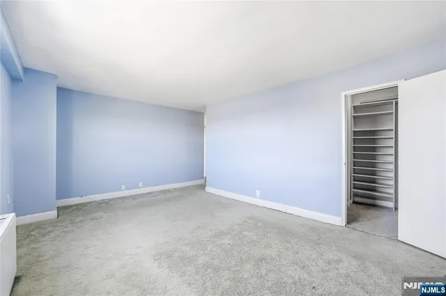 a view of an empty room and entryway