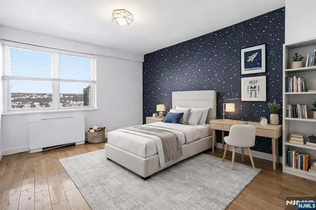 a bedroom with a bed and a bookshelf