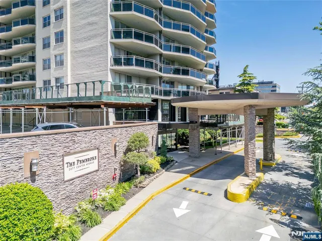 a front view of a building with porch and entertaining space