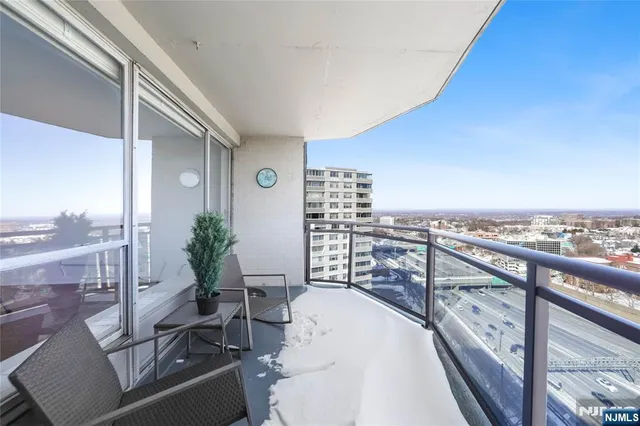 a view of balcony with furniture