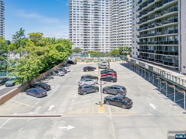a table with chairs and potted plants
