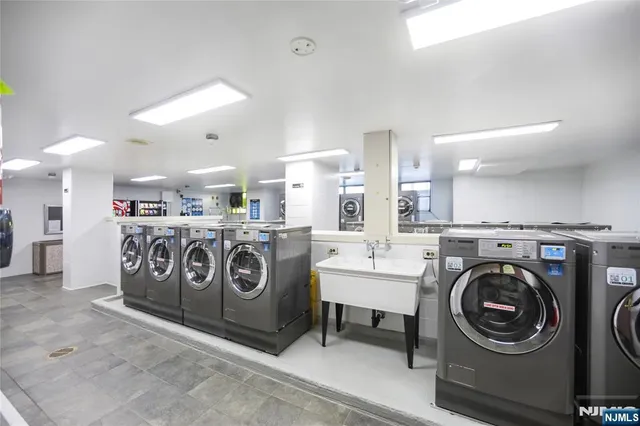 a view of a storage & utility room with washer and dryer
