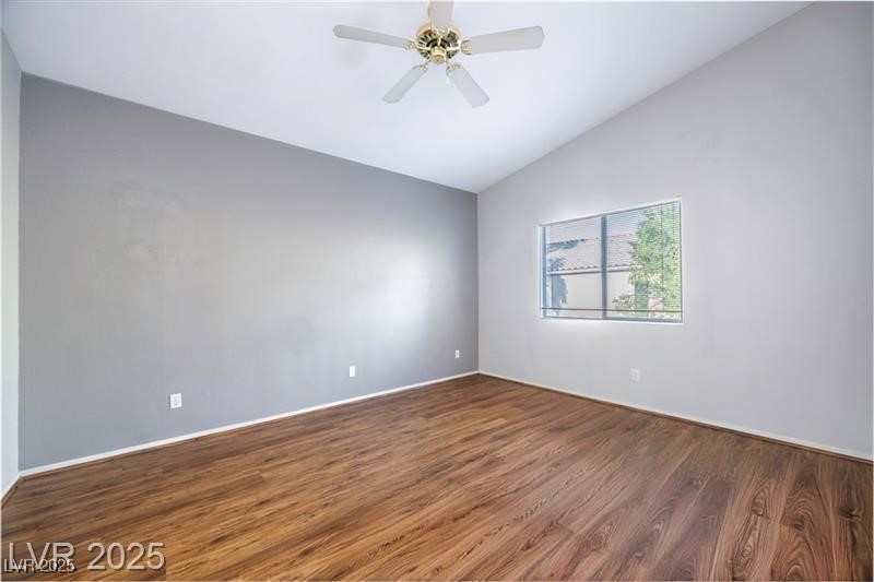 2152 Turquoise Ridge Street, Unit 202 Las Vegas, NV 89117 - Photo 11 of 23 Unfurnished room with wood finished floors, lofted ceiling, and a ceiling fan