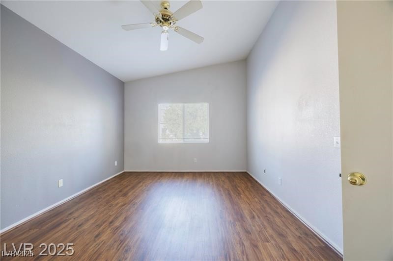 2152 Turquoise Ridge Street, Unit 202 Las Vegas, NV 89117 - Photo 8 of 23 Spare room featuring lofted ceiling, dark wood-style floors, and ceiling fan