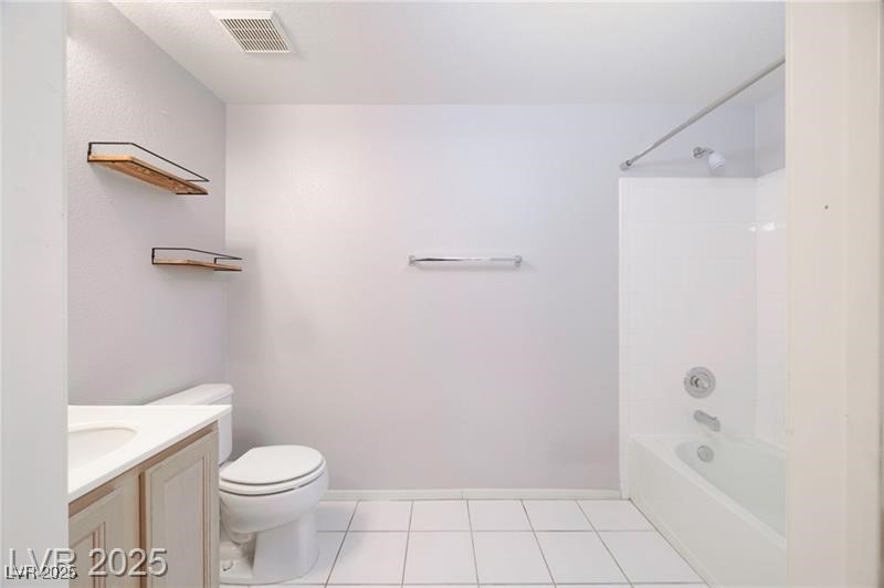 2152 Turquoise Ridge Street, Unit 202 Las Vegas, NV 89117 - Photo 10 of 23 Bathroom featuring light tile patterned floors, vanity, and bathing tub / shower combination