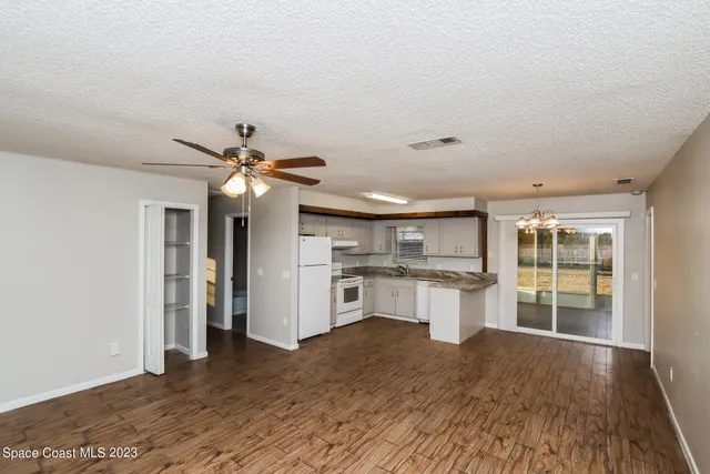 a kitchen with stainless steel appliances granite countertop a stove and cabinets