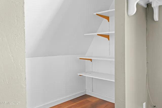 a bedroom with a bed and a table