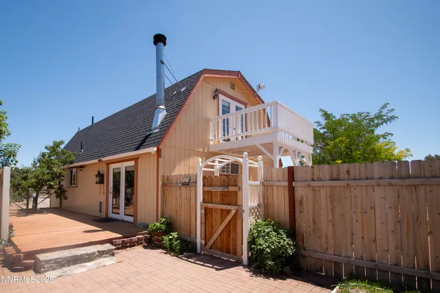 a view of a fence and trees