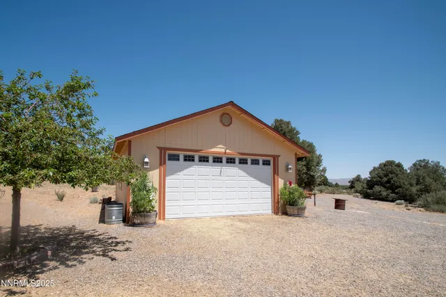a park view with bench and trees