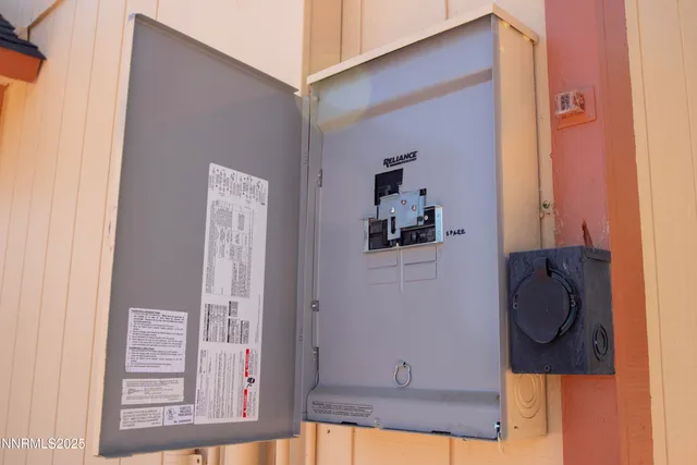 an aerial view of a house with a yard and covered with swimming pool