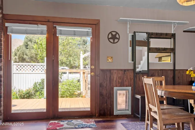 a view of a dining room with furniture and windows