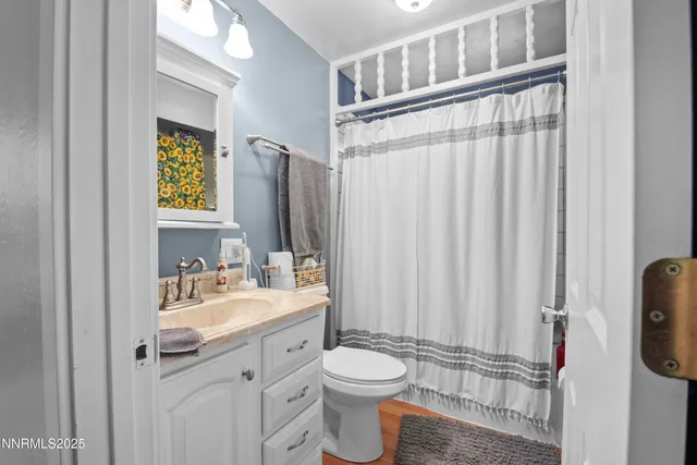 a kitchen with stainless steel appliances cabinets and a window