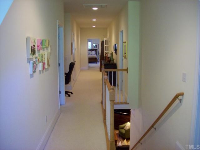 8204 Dreamy Way Raleigh, NC 27613 - Photo 11 of 12 Second floor hallway features access to both bedrooms, computer niche, office & bonus room