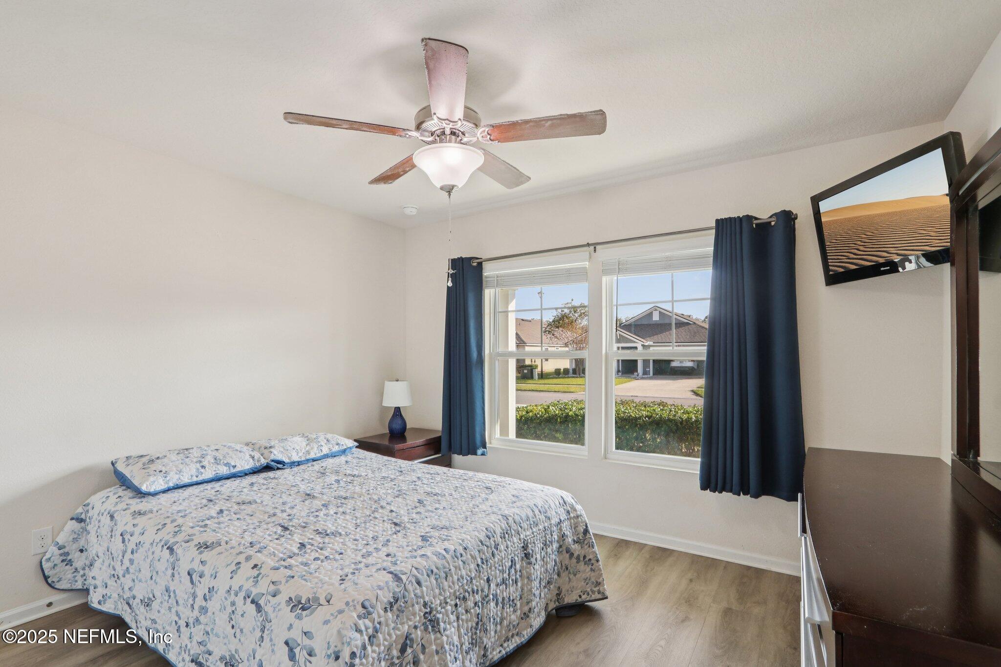 4100 Spring Creek Lane Middleburg, FL 32068 - Photo 17 of 58 a bedroom with a bed and a large window