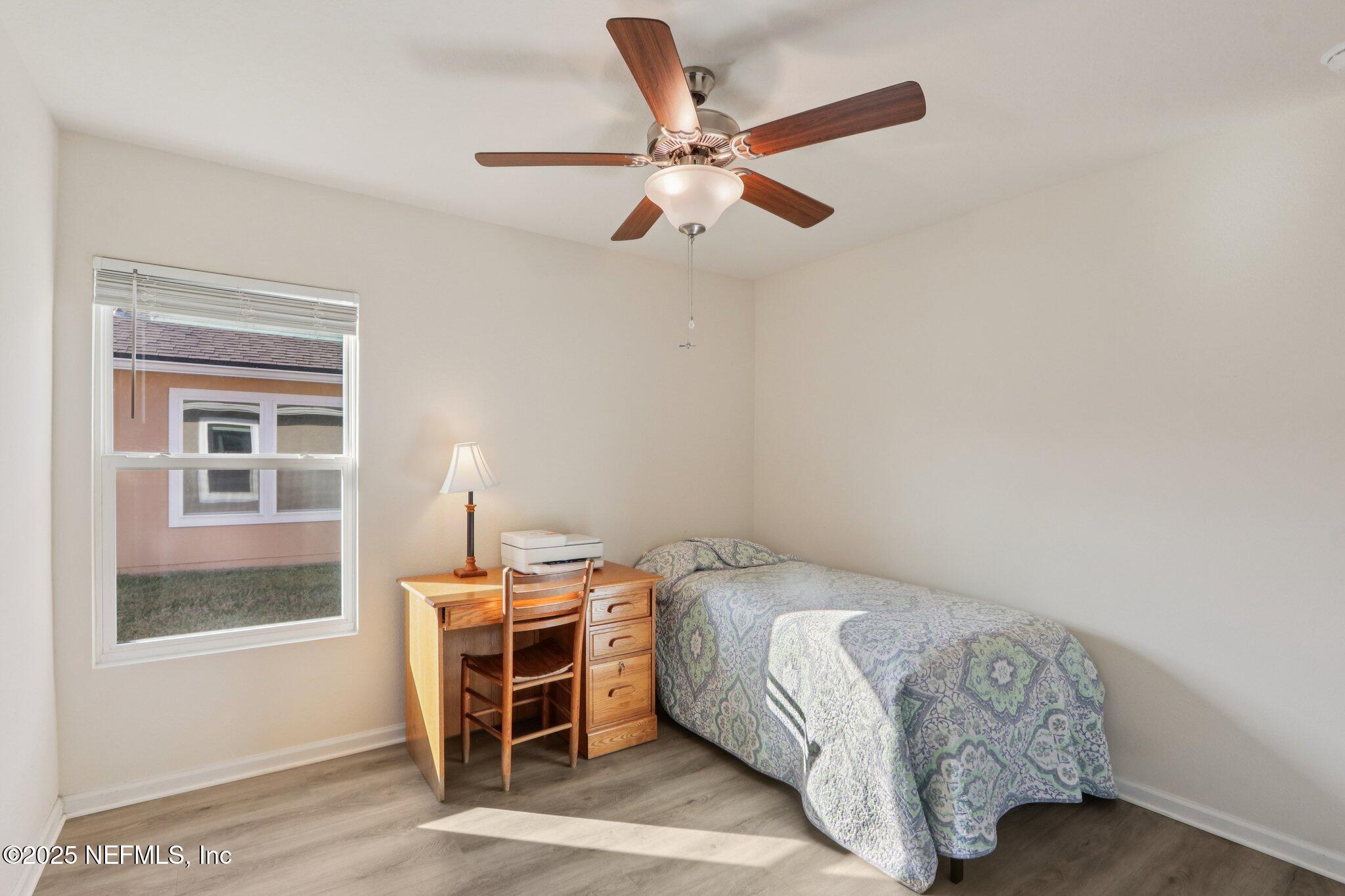 4100 Spring Creek Lane Middleburg, FL 32068 - Photo 20 of 58 a bedroom with a bed and a window