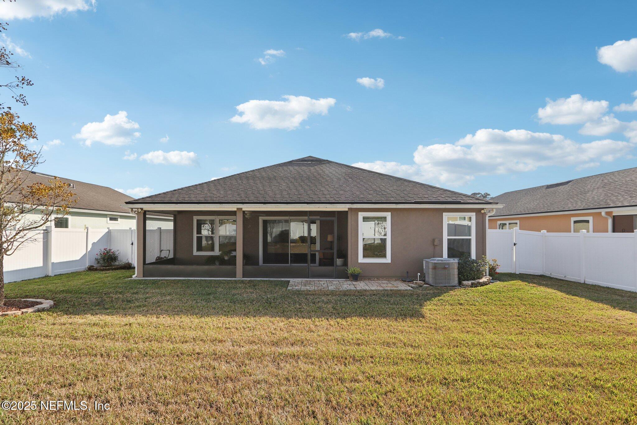 4100 Spring Creek Lane Middleburg, FL 32068 - Photo 31 of 58 a front view of a house with a yard