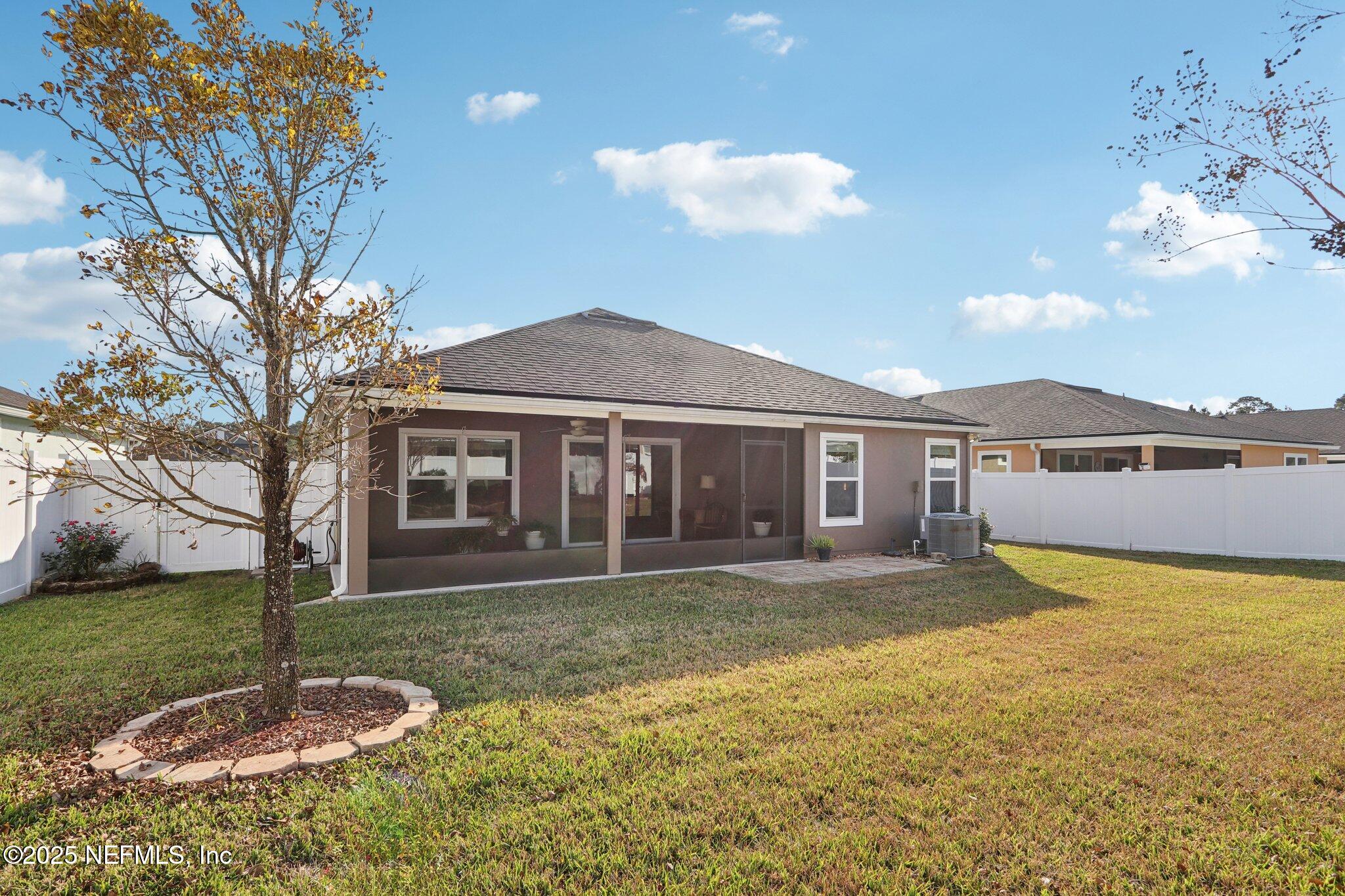 4100 Spring Creek Lane Middleburg, FL 32068 - Photo 32 of 58 a front view of a house with a yard