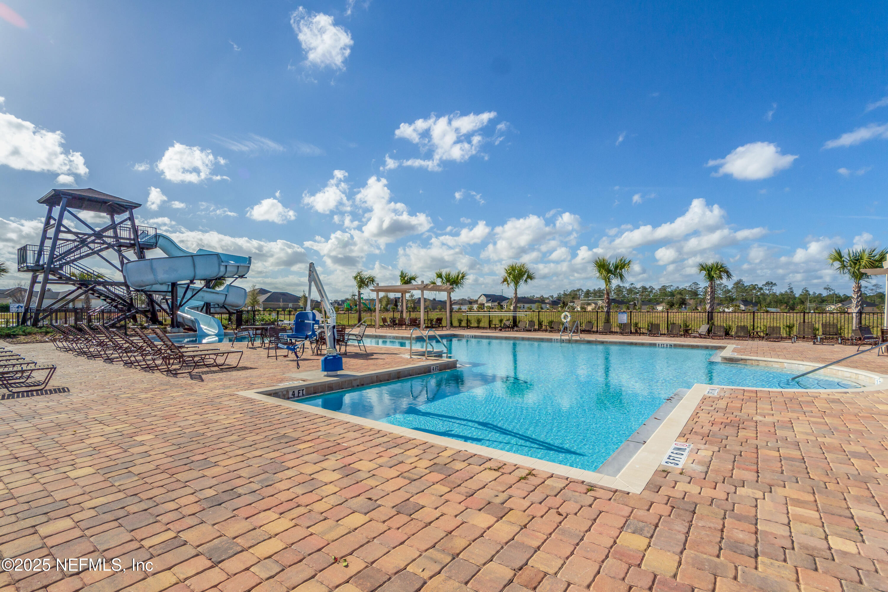 4100 Spring Creek Lane Middleburg, FL 32068 - Photo 40 of 58 a view of a swimming pool and lounge chair