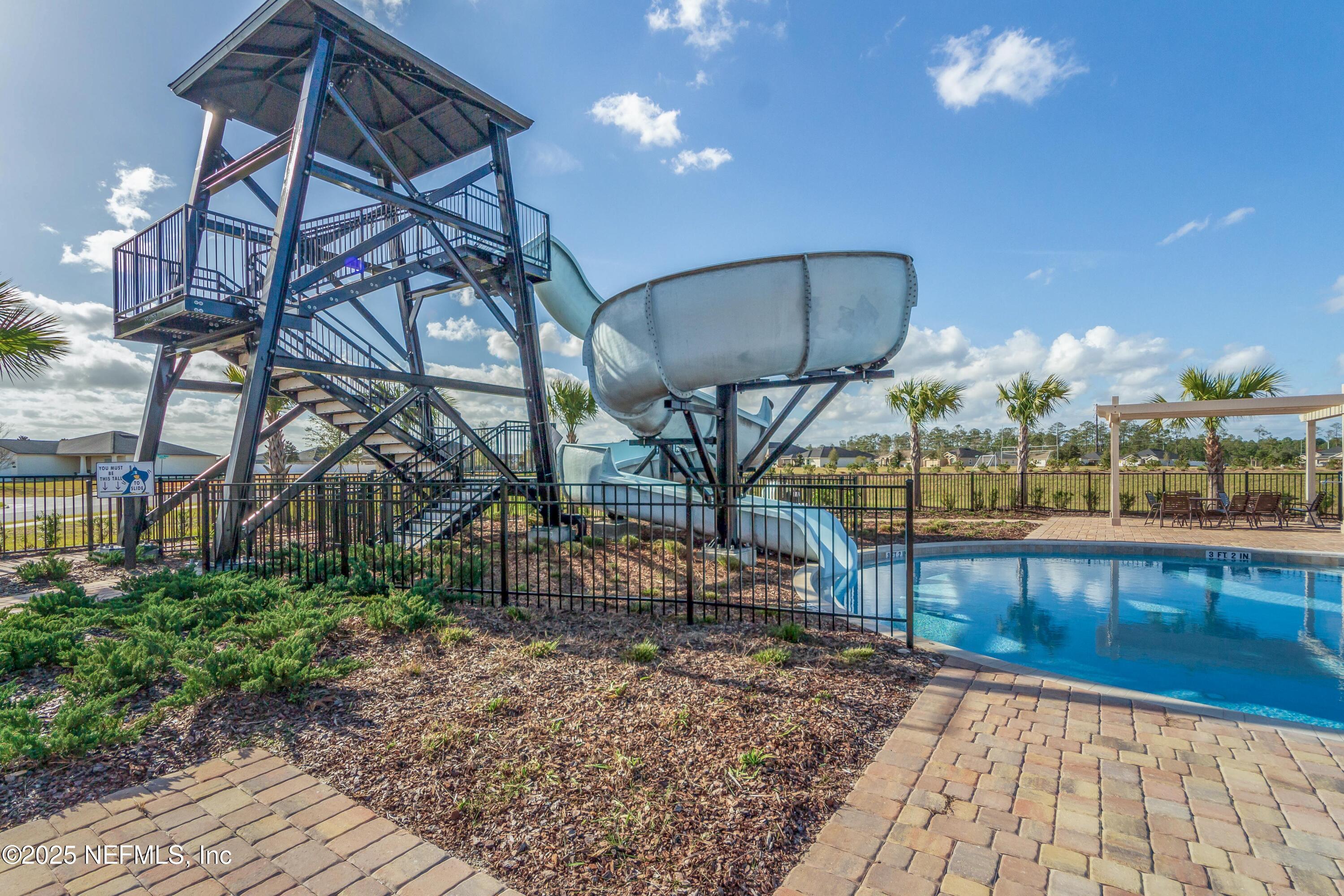 4100 Spring Creek Lane Middleburg, FL 32068 - Photo 44 of 58 a view of a swimming pool with a patio
