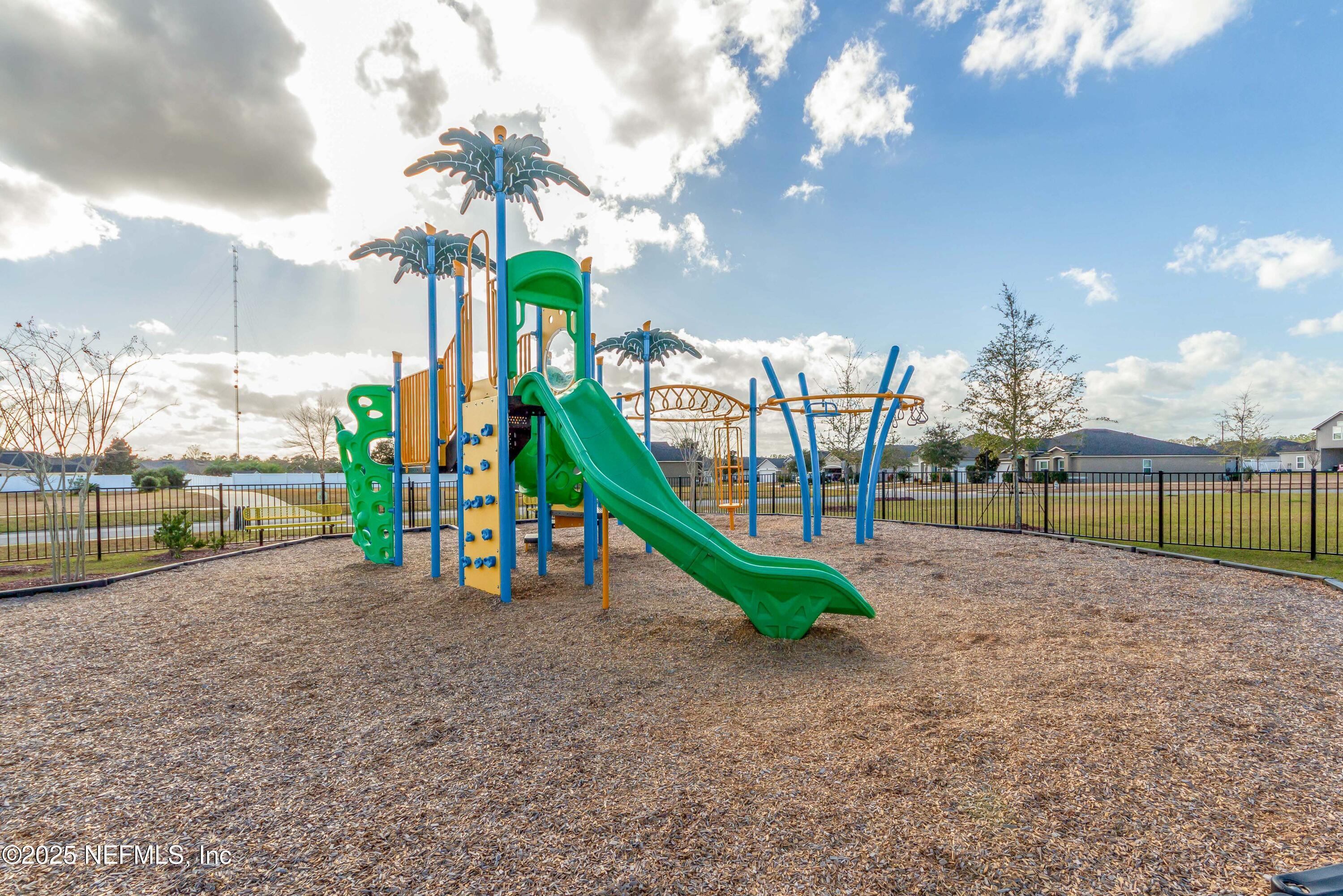 4100 Spring Creek Lane Middleburg, FL 32068 - Photo 48 of 58 a childrens park with lots of swings and slides